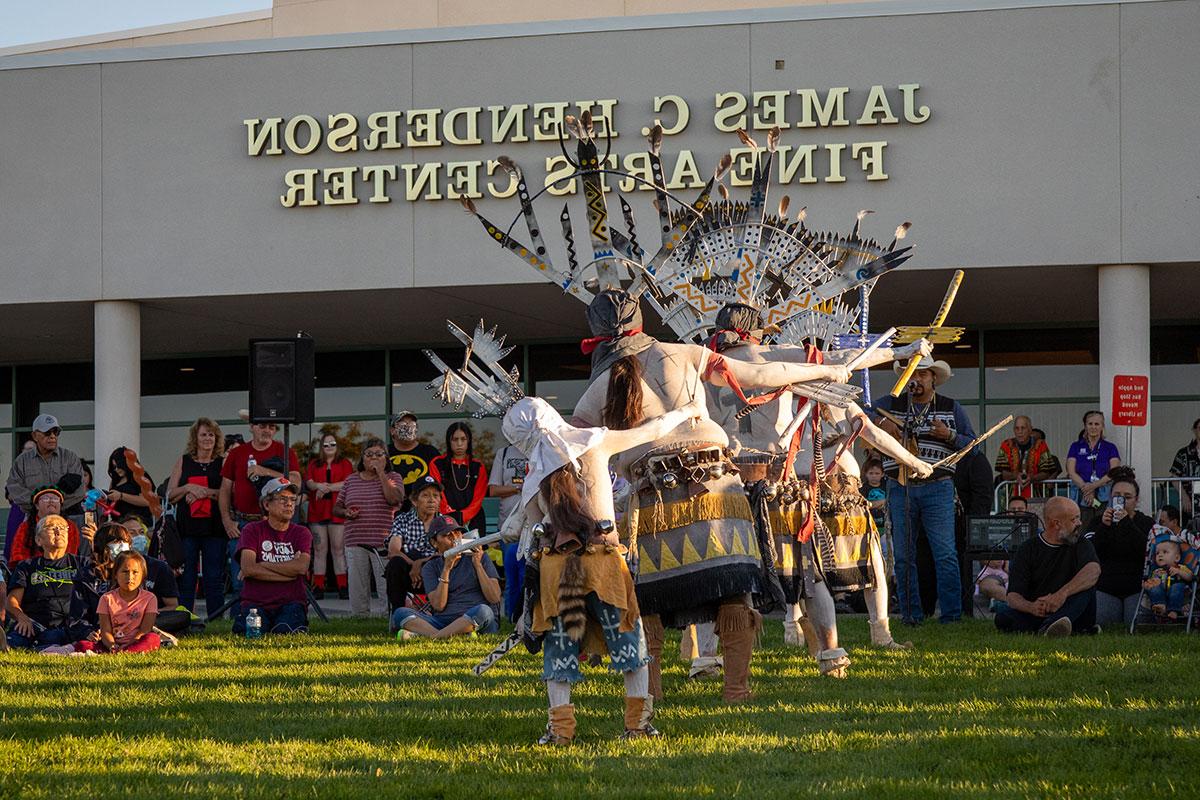 Dancers performing in their traditional clothing at the San Juan College Balloon Glow